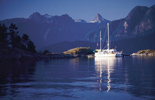 Haida Gwaii with boats on a calm sunny day